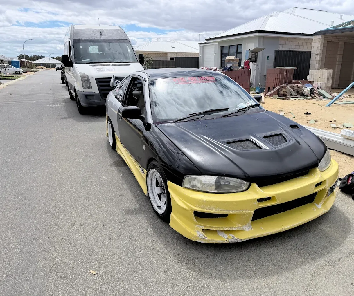 JDM coupe with the mobile service van